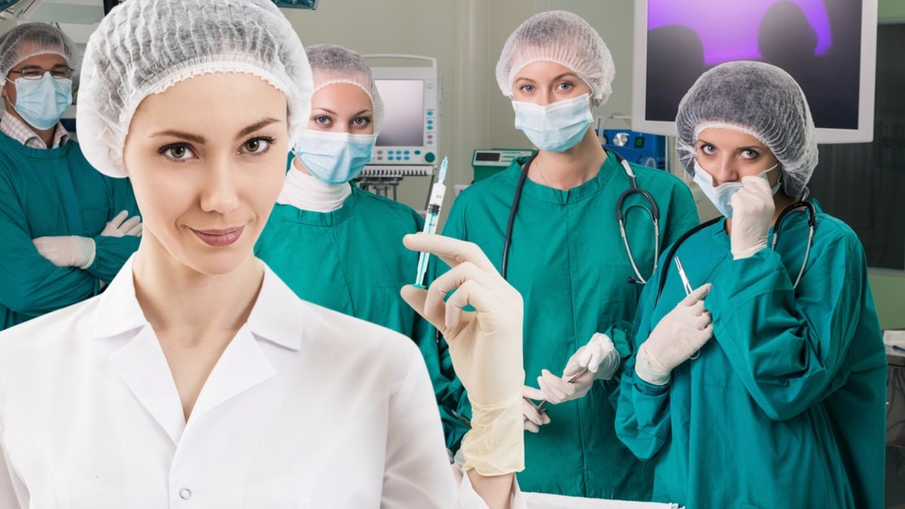 Young female anesthetist with syringe on the surgery teem background